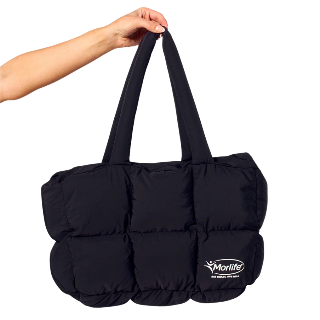 Black puffer bag held by a hand with Morlife logo on a white background