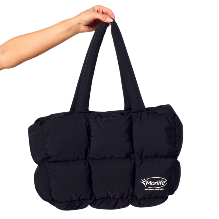 Black puffer bag held by a hand with Morlife logo on a white background